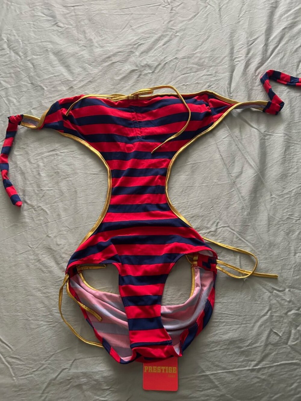 NWT Very sexy cut out red and navy striped with gold trim one-piece bathing suit